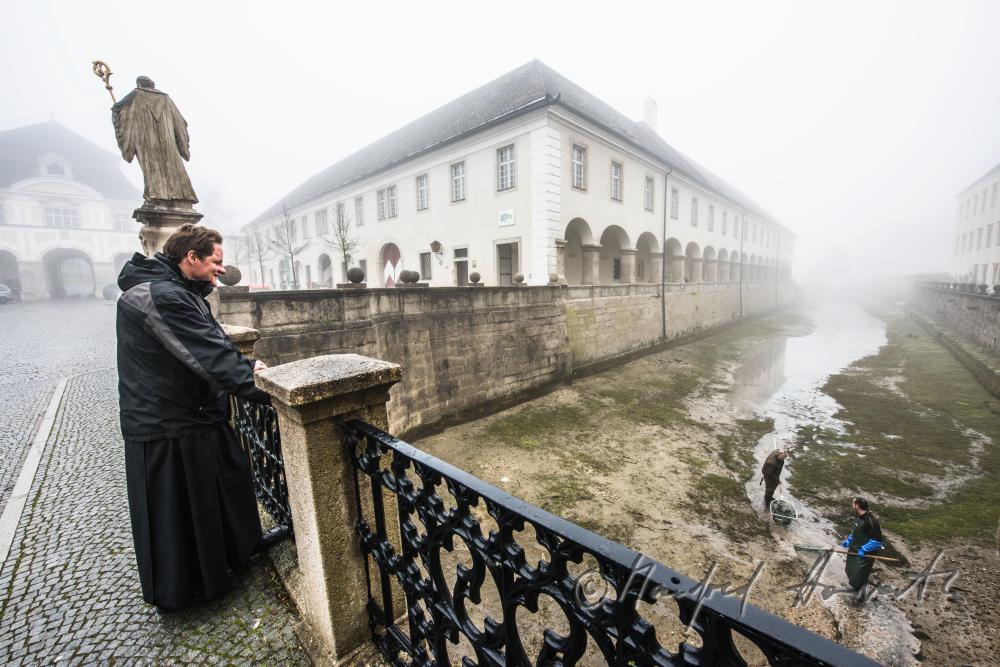 Black Monk looking down at the fishermen in the trout pond