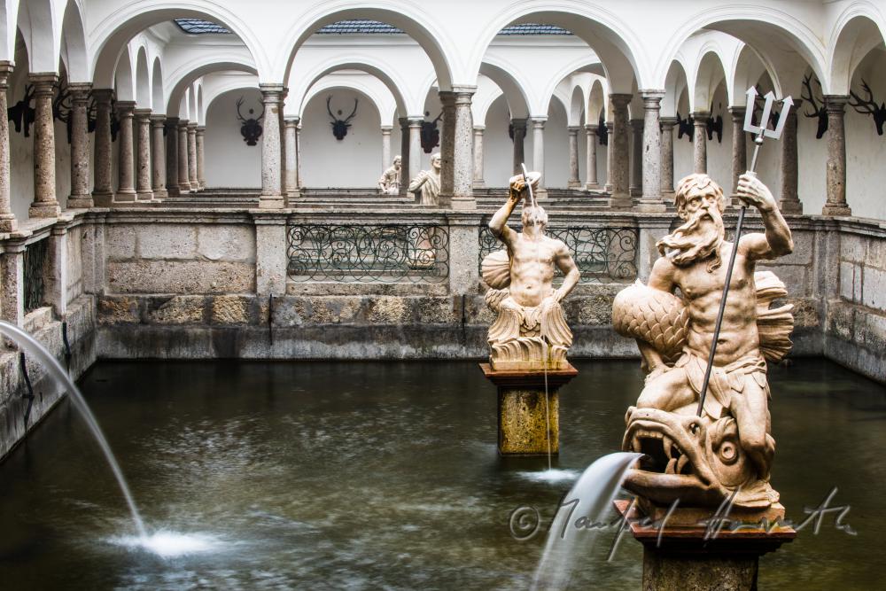 baroque statue of Neptun at the fish tank
