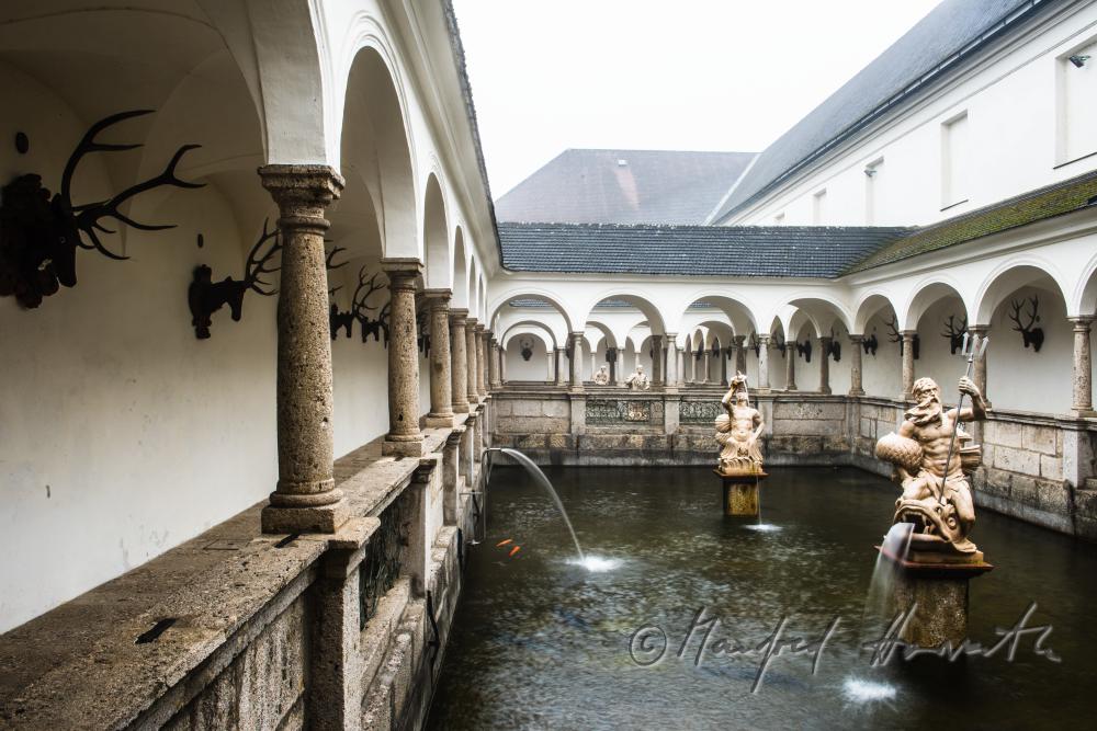 baroque statue of Neptun at the fish tank