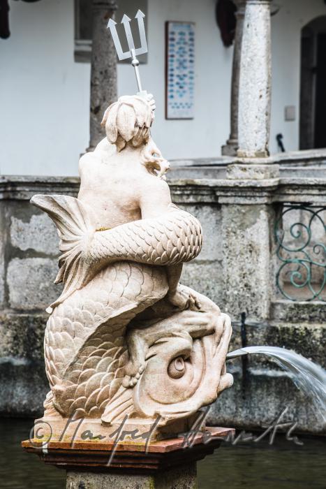 baroque statue of Neptun at the fish tank