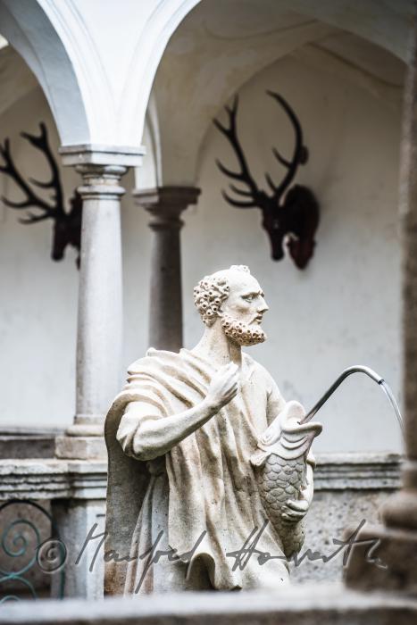 baroque statue of Saint Peter at the fish tank