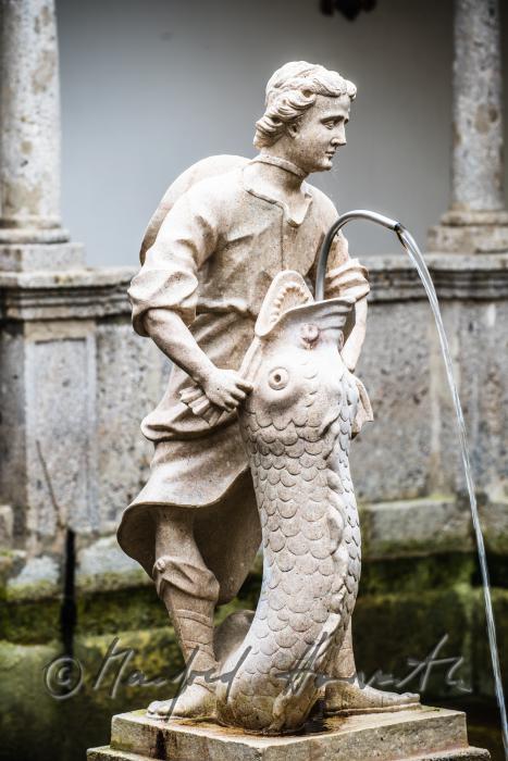 baroque statue of David at the fish tank