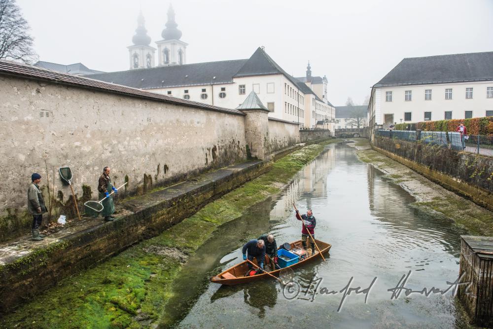 fishermen at the trout pond of the monastery