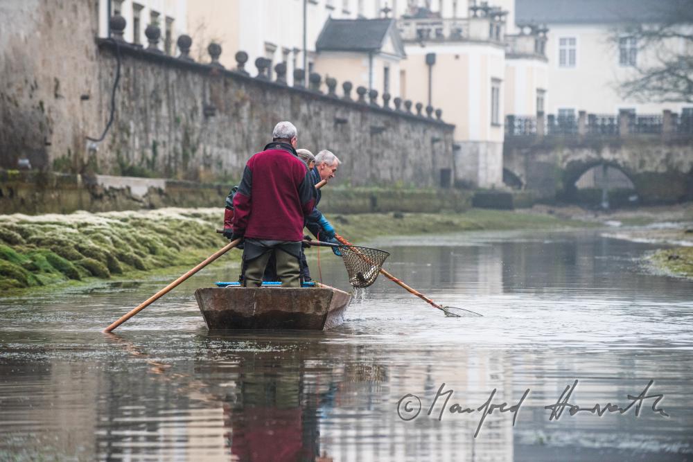fishermen at the trout pond of the monastery