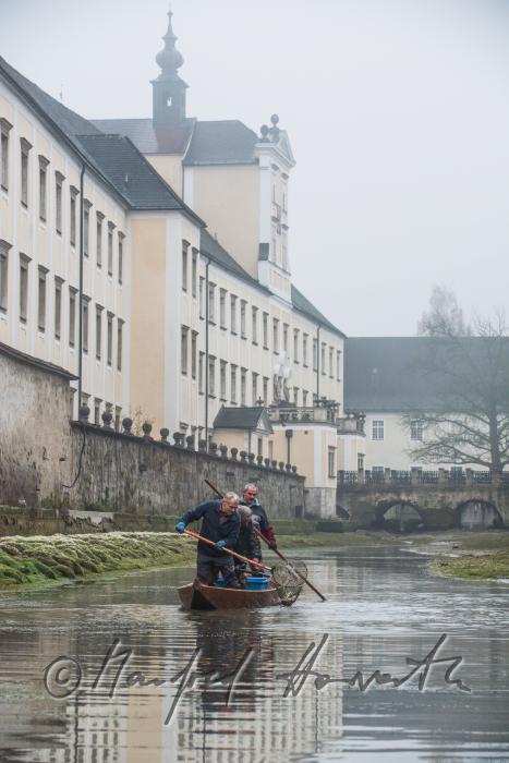 fishermen at the trout pond of the monastery