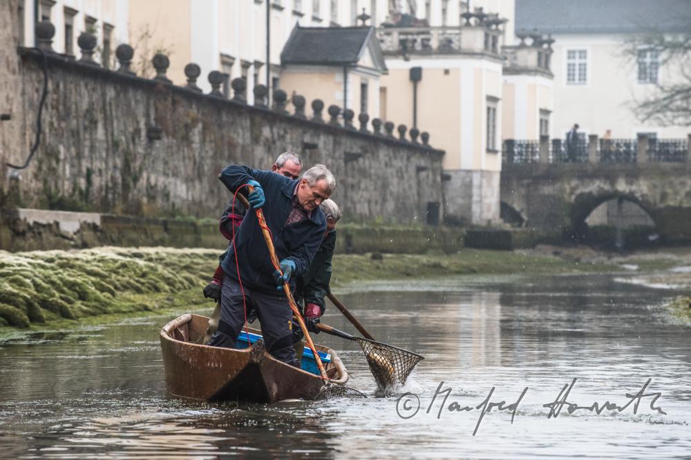 fishermen at the trout pond of the monastery