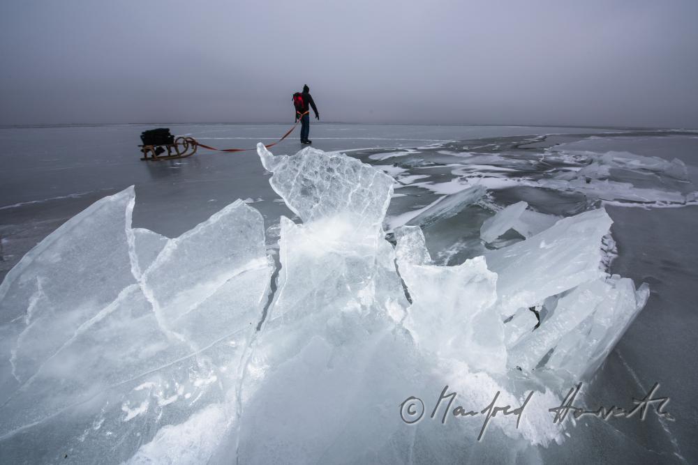 ice skaters with a slade near an ice jam