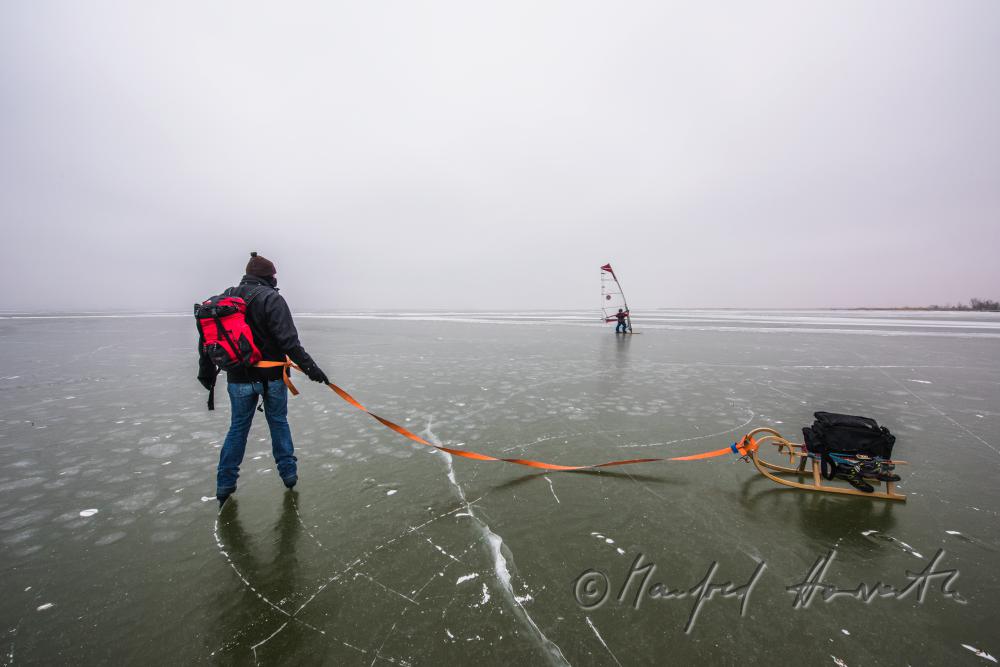ice skaters with a slade near an ice jam