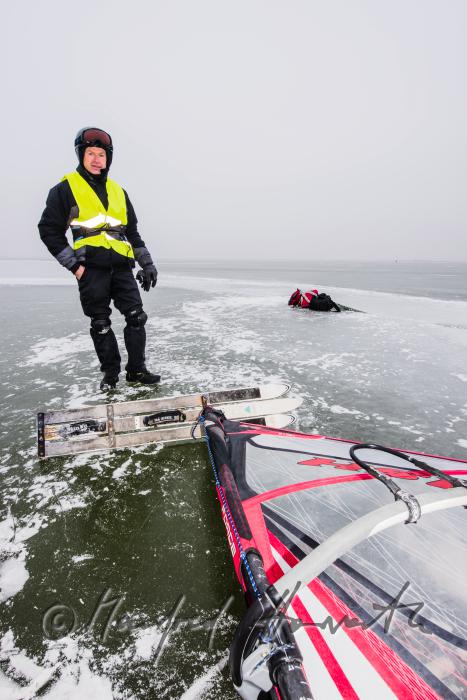 ice skaters with a slade near an ice jam