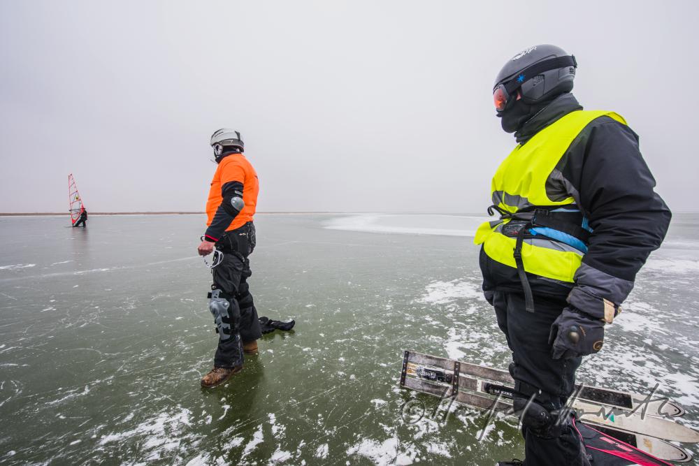 ice skaters with a slade near an ice jam