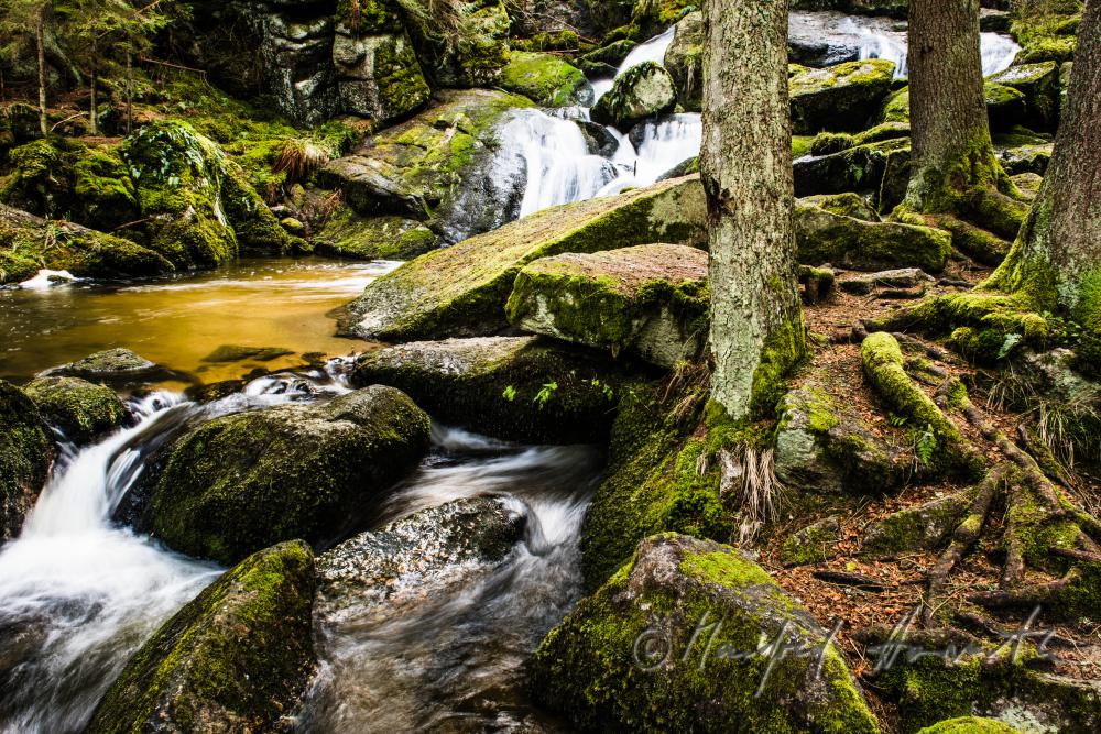Lohnbachfall and granite bouldrs in the forest