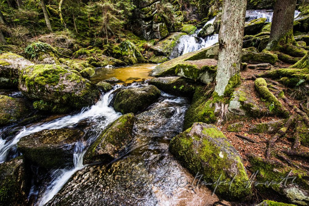 Lohnbachfall and granite bouldrs in the forest