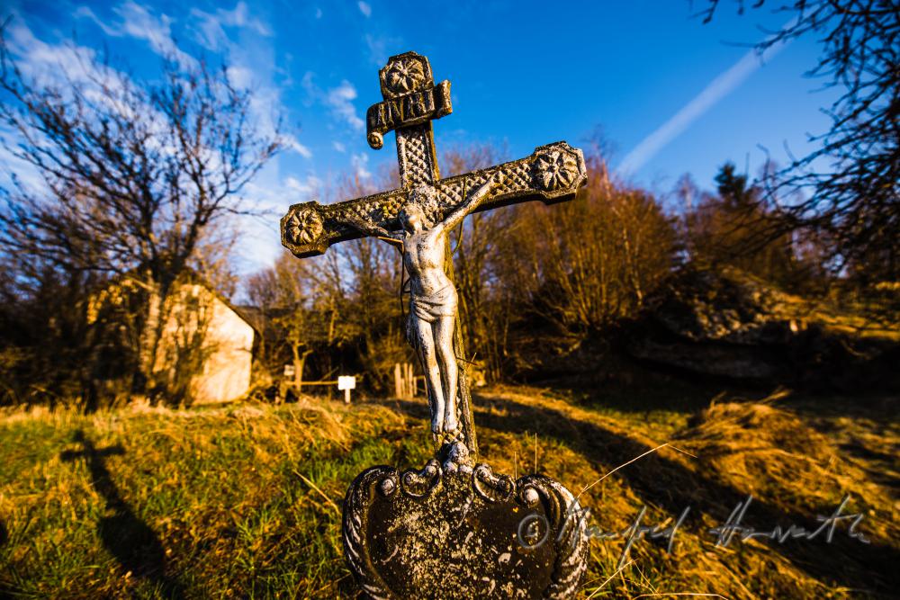 grave cross of a farm house in the middle of nowhere